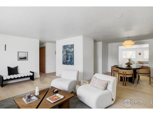 a living room with furniture and a rug