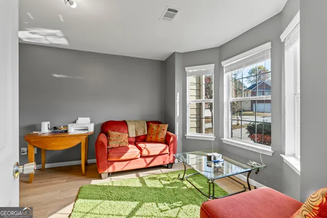 a view of a dining room with furniture and chandelier