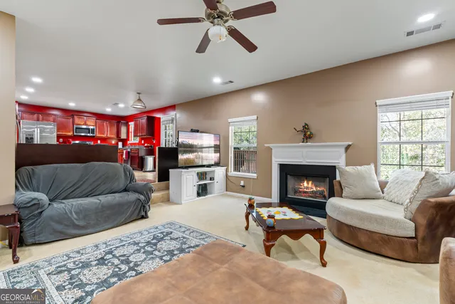 a view of a livingroom with furniture and window