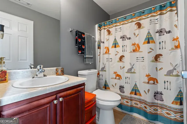 an aerial view of a house with a yard and garden