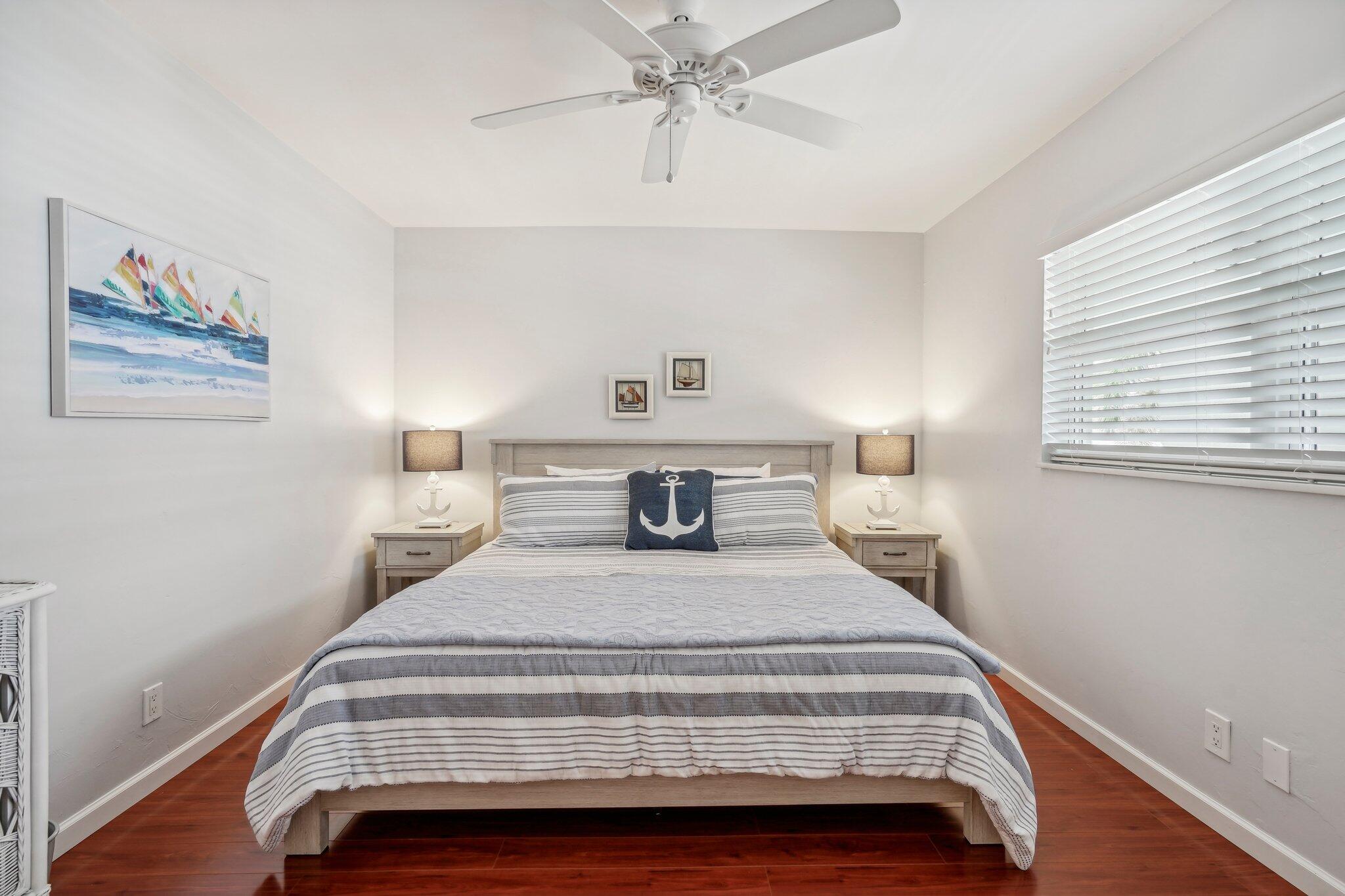 5540 North Ocean Boulevard, Unit 212 Ocean Ridge, FL 33435 - Photo 16 of 41 a bedroom with a bed and window