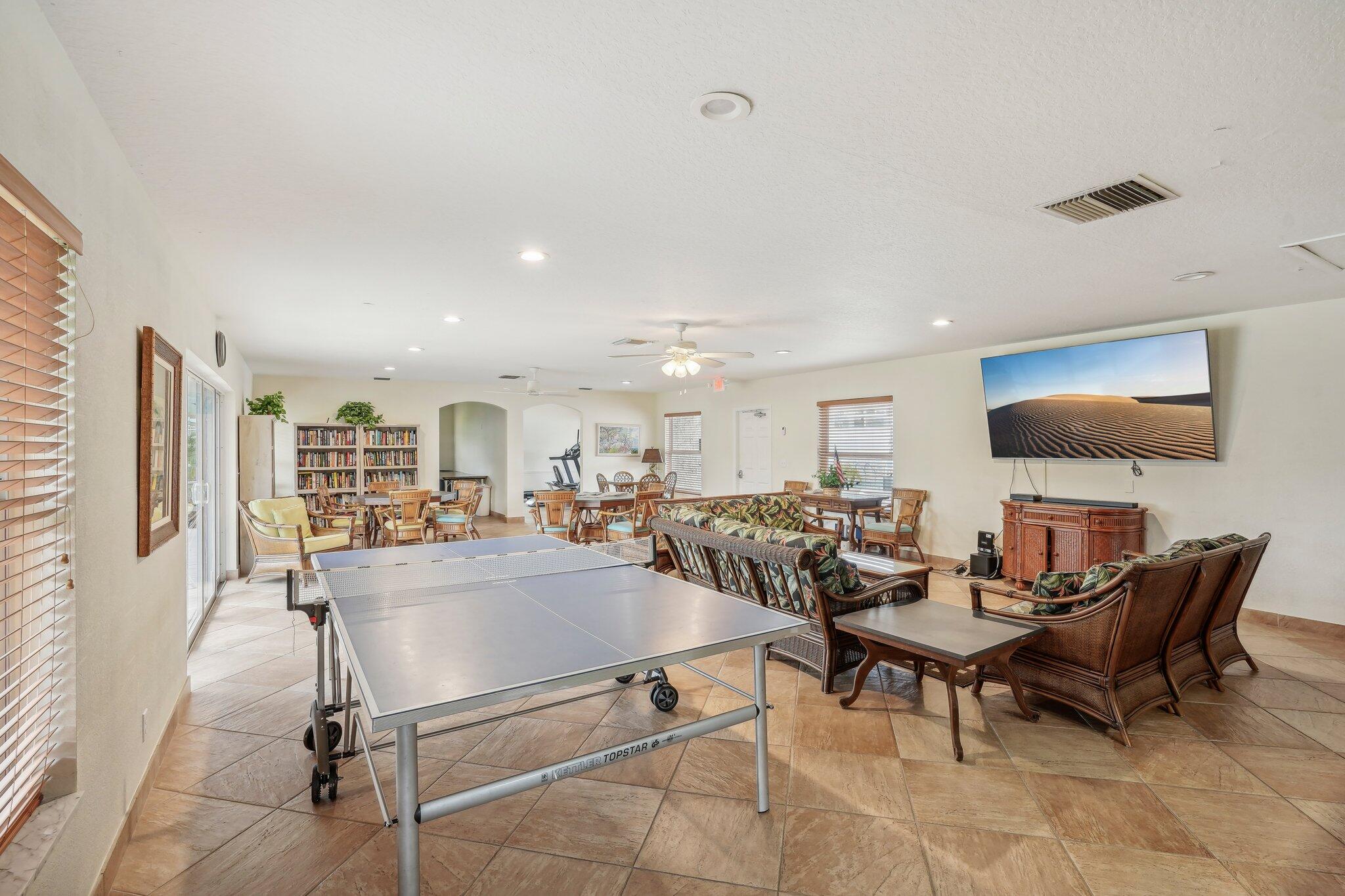 5540 North Ocean Boulevard, Unit 212 Ocean Ridge, FL 33435 - Photo 24 of 41 a living room with furniture and a flat screen tv