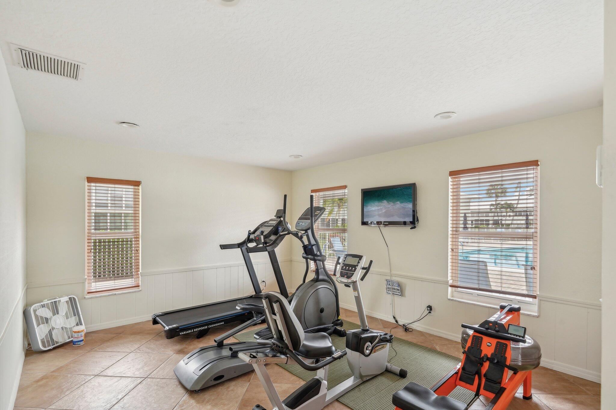 5540 North Ocean Boulevard, Unit 212 Ocean Ridge, FL 33435 - Photo 27 of 41 a view of a room with gym equipment