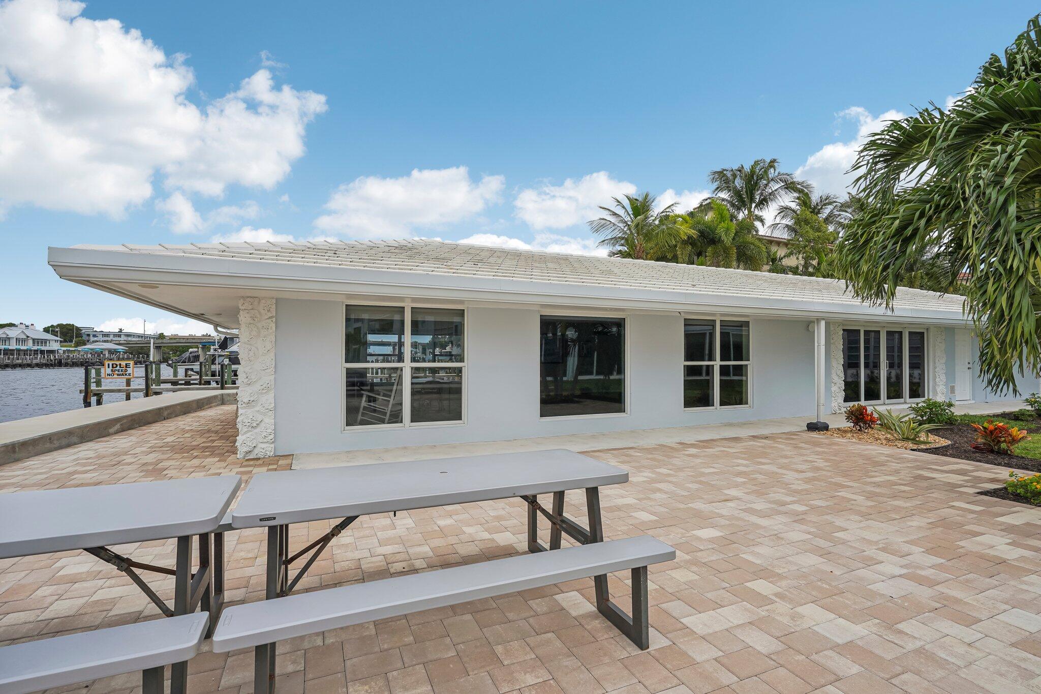 5540 North Ocean Boulevard, Unit 212 Ocean Ridge, FL 33435 - Photo 34 of 41 a view of a house with backyard sitting area and tub