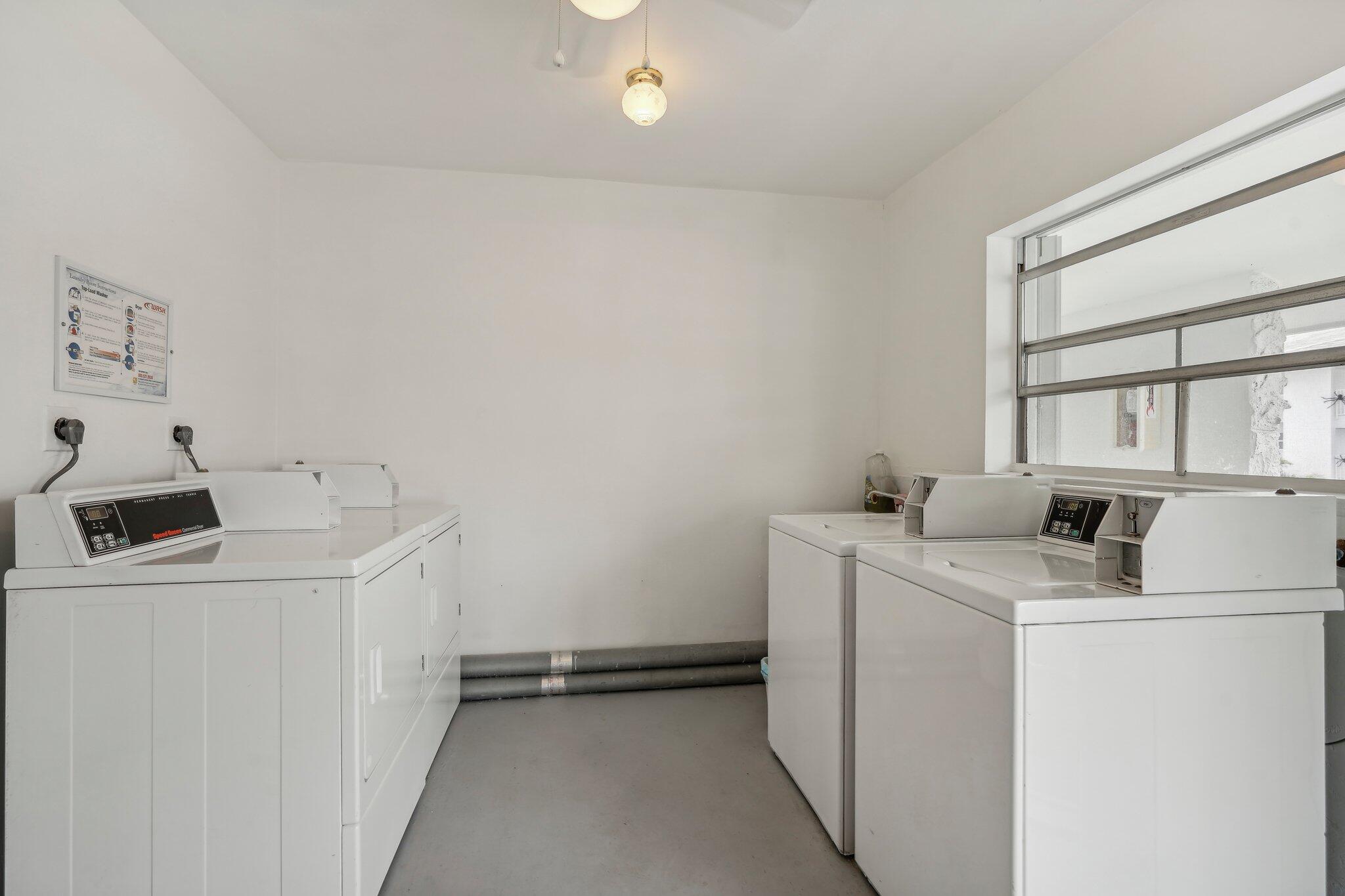 5540 North Ocean Boulevard, Unit 212 Ocean Ridge, FL 33435 - Photo 41 of 41 a utility room with dryer and washer