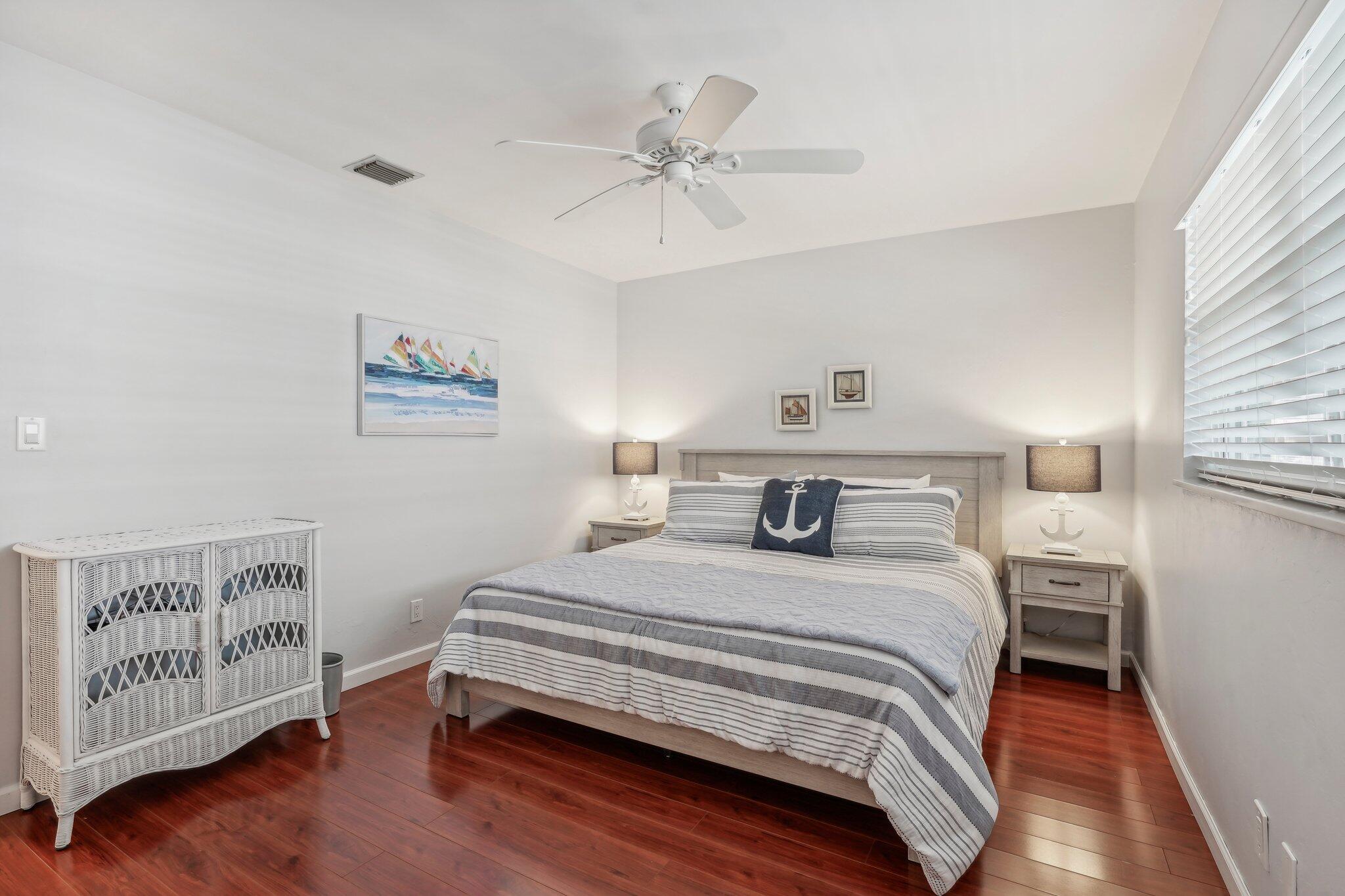 5540 North Ocean Boulevard, Unit 212 Ocean Ridge, FL 33435 - Photo 6 of 41 a bedroom with a bed and a window