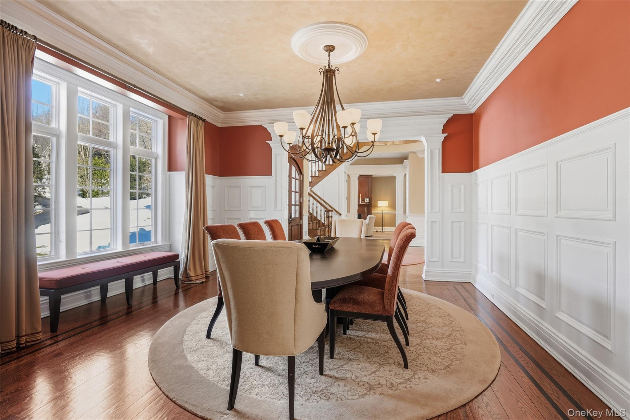 26 Hollow Ridge Road Bedford Corners, NY 10549 - Photo 11 of 39 a view of a dining room with furniture a chandelier and wooden floor