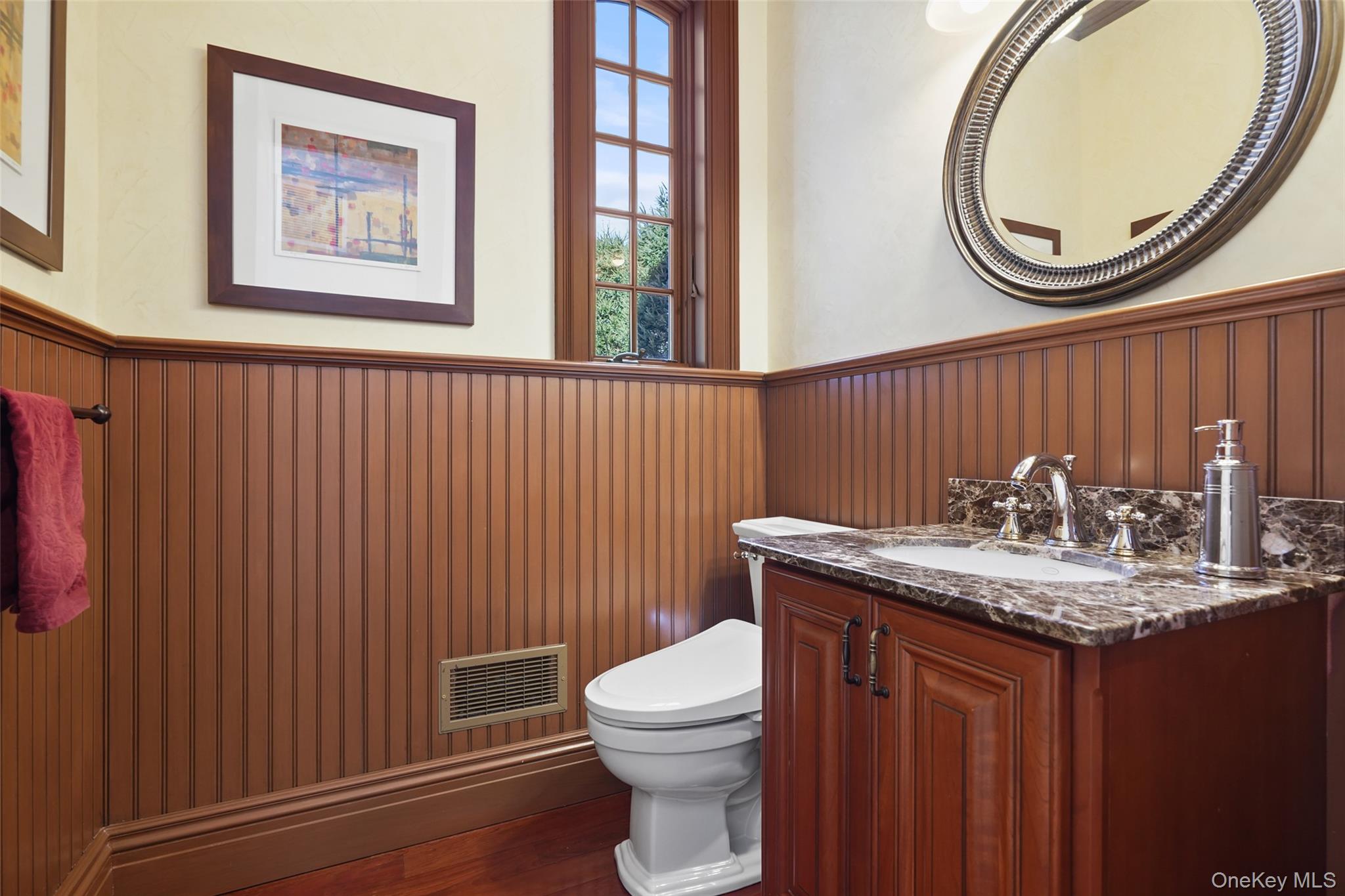 26 Hollow Ridge Road Bedford Corners, NY 10549 - Photo 14 of 39 a bathroom with a granite countertop toilet a sink and a mirror