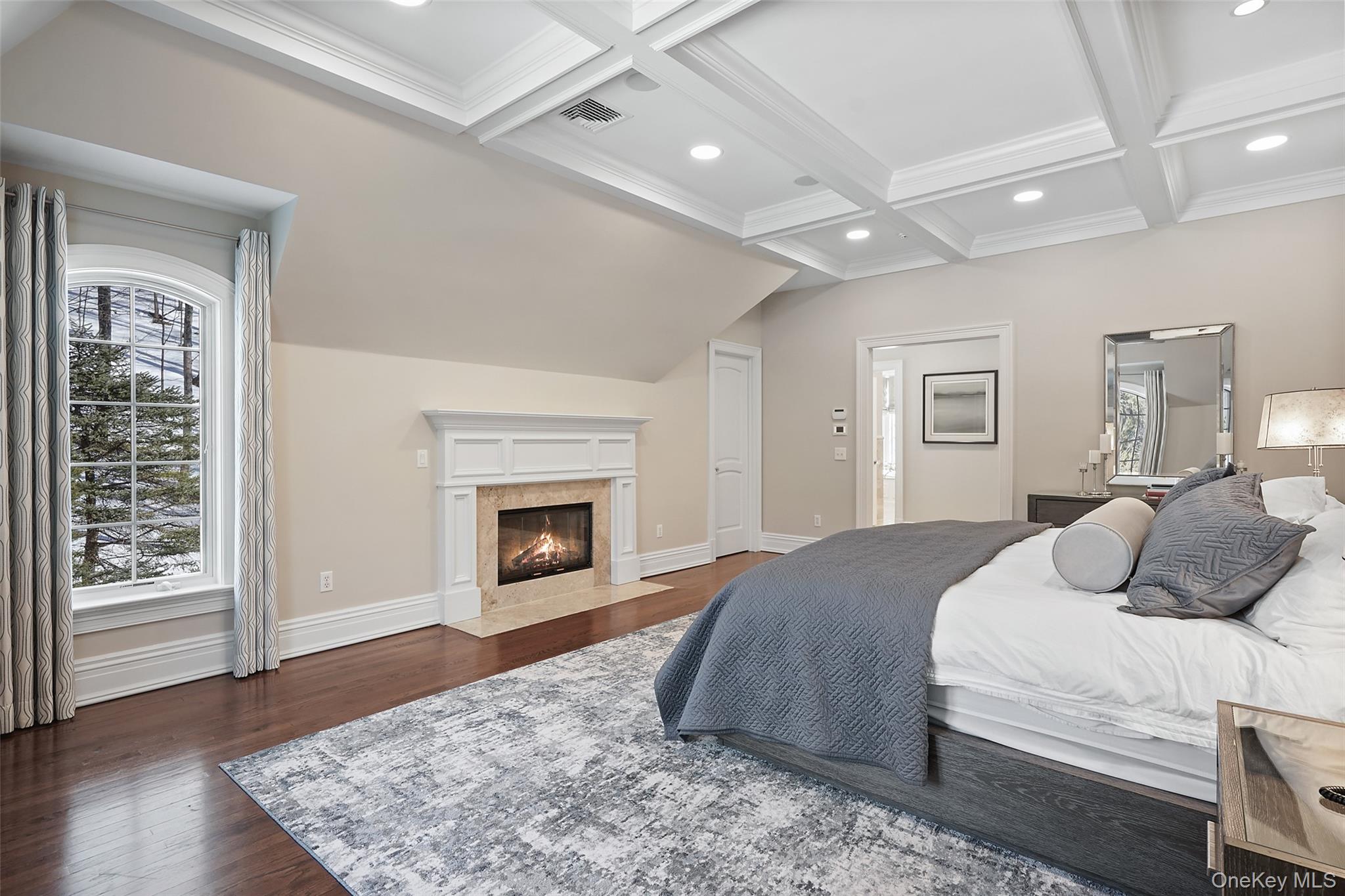 26 Hollow Ridge Road Bedford Corners, NY 10549 - Photo 16 of 39 a spacious bedroom with a large bed and a fireplace