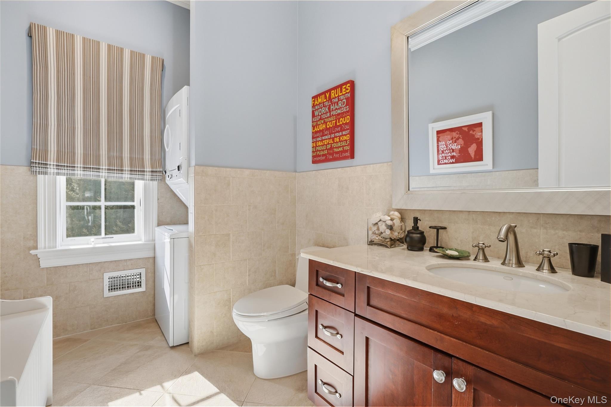 26 Hollow Ridge Road Bedford Corners, NY 10549 - Photo 36 of 39 a bathroom with a toilet a sink and a window