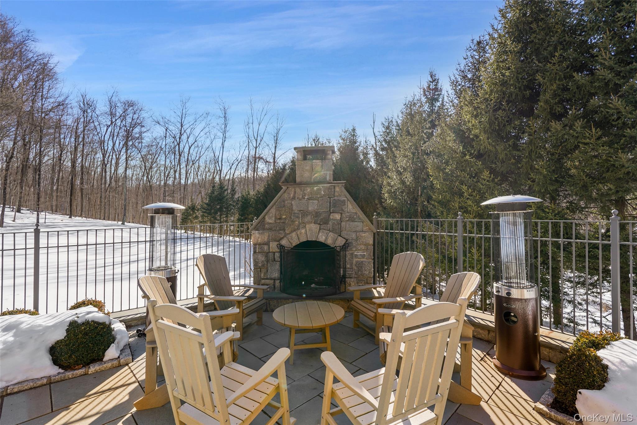 26 Hollow Ridge Road Bedford Corners, NY 10549 - Photo 37 of 39 a roof deck with table and chairs potted plants and a palm tree