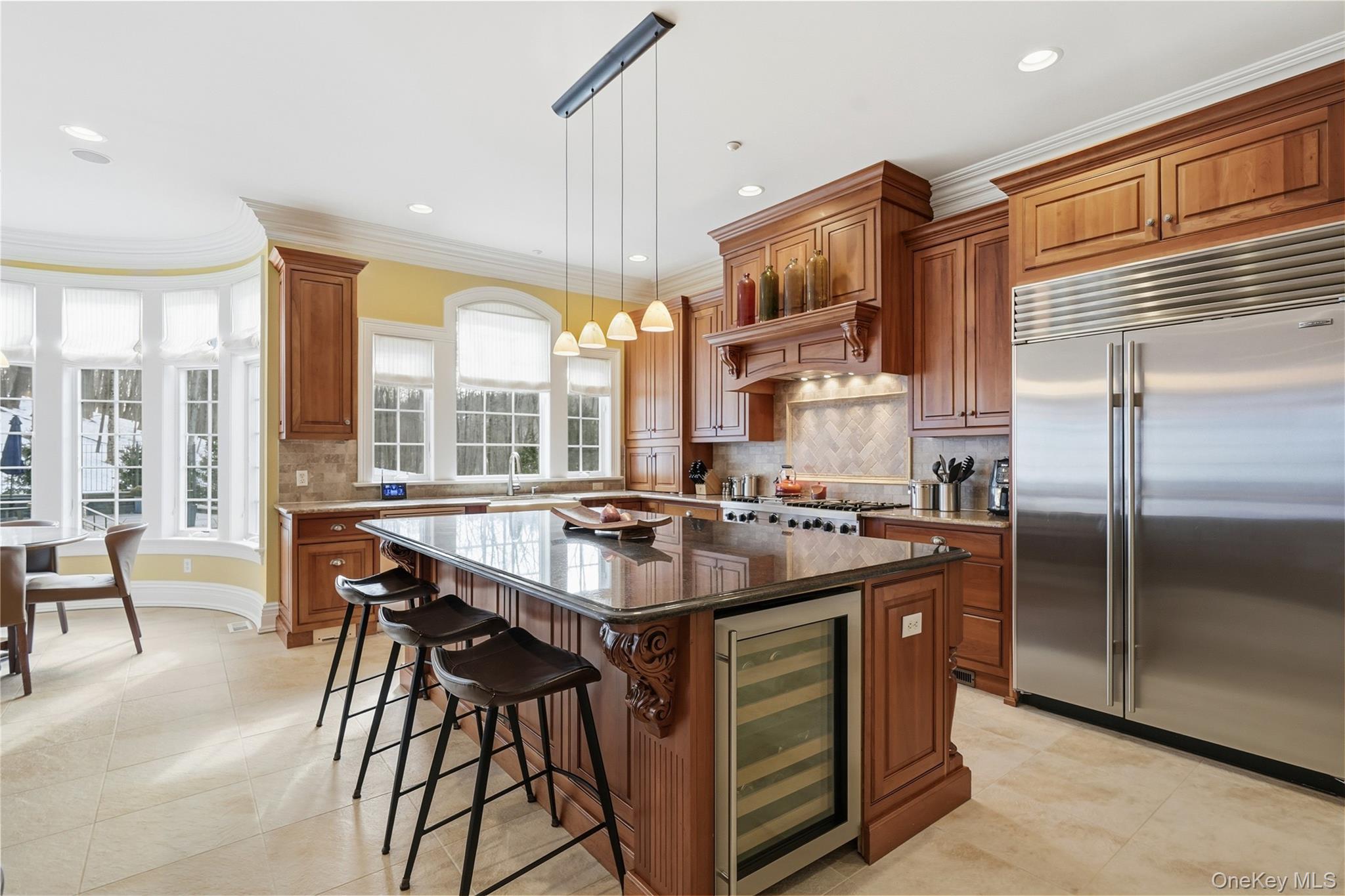 26 Hollow Ridge Road Bedford Corners, NY 10549 - Photo 5 of 39 a kitchen with a stove a refrigerator and a dining table