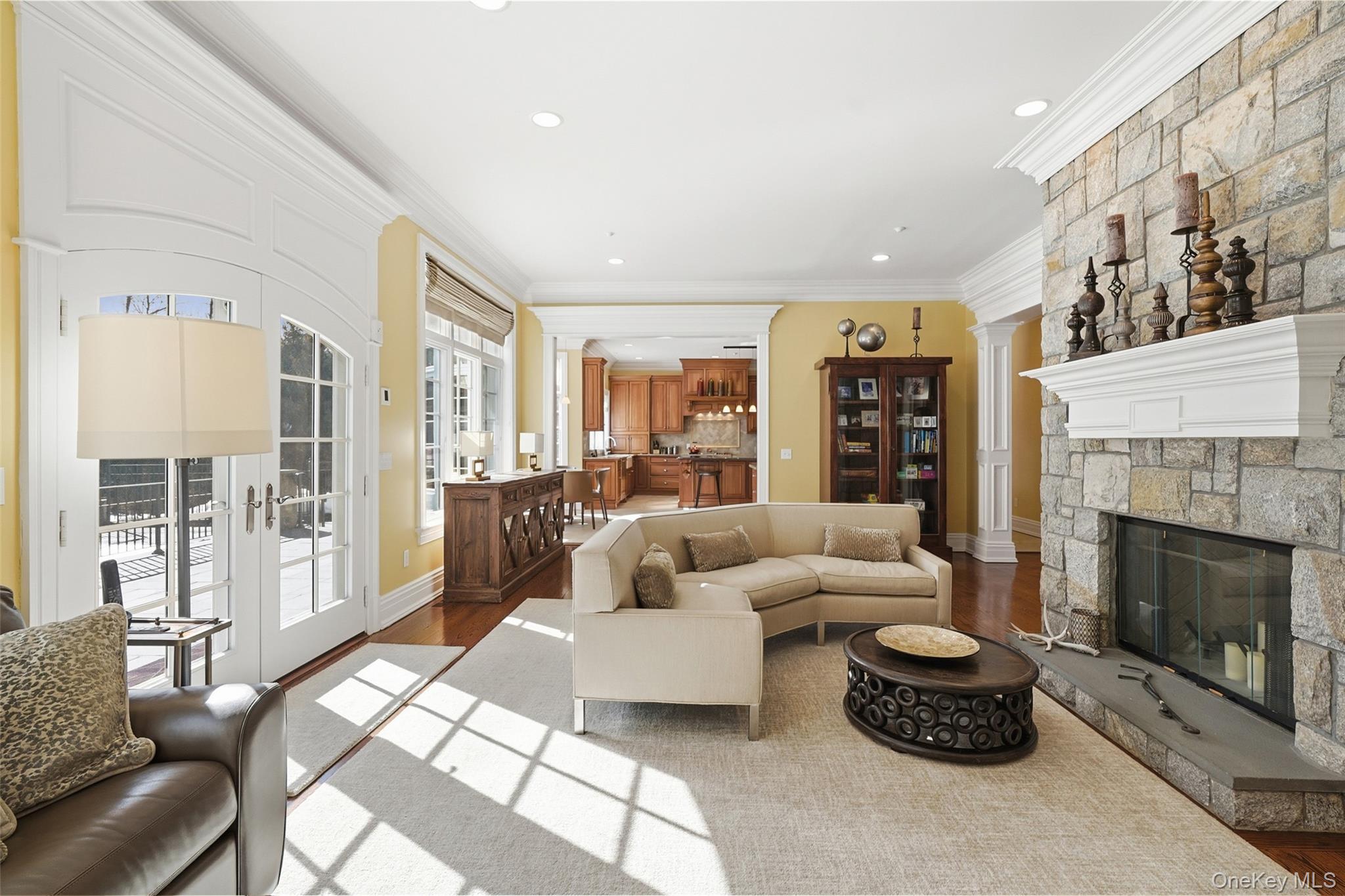 26 Hollow Ridge Road Bedford Corners, NY 10549 - Photo 8 of 39 a living room with furniture a fireplace and a large window