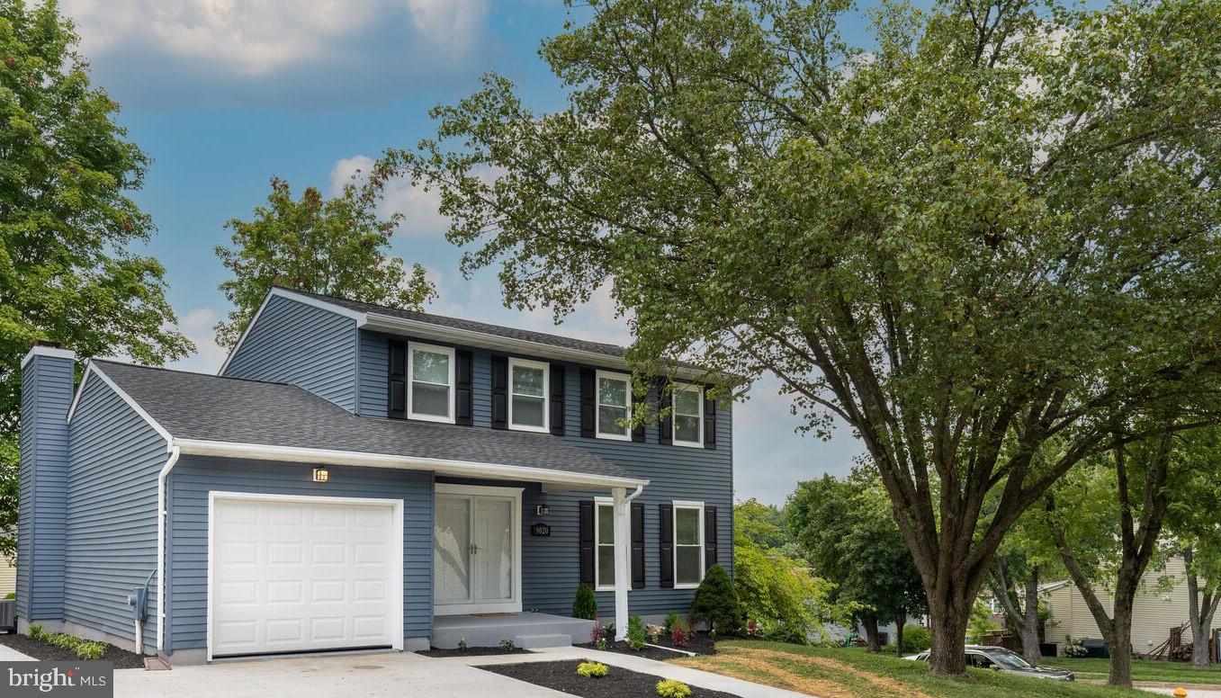 9020 Moonstone Road Baltimore, MD 21236 - Photo 1 of 30 a front view of a house with a garden