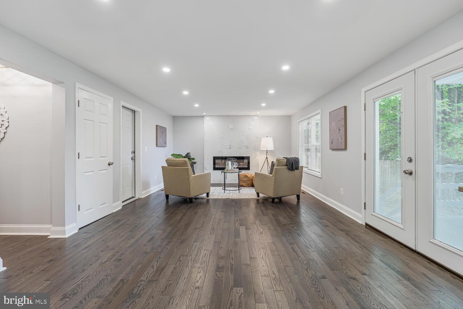 9020 Moonstone Road Baltimore, MD 21236 - Photo 11 of 30 a living room with furniture and a wooden floor