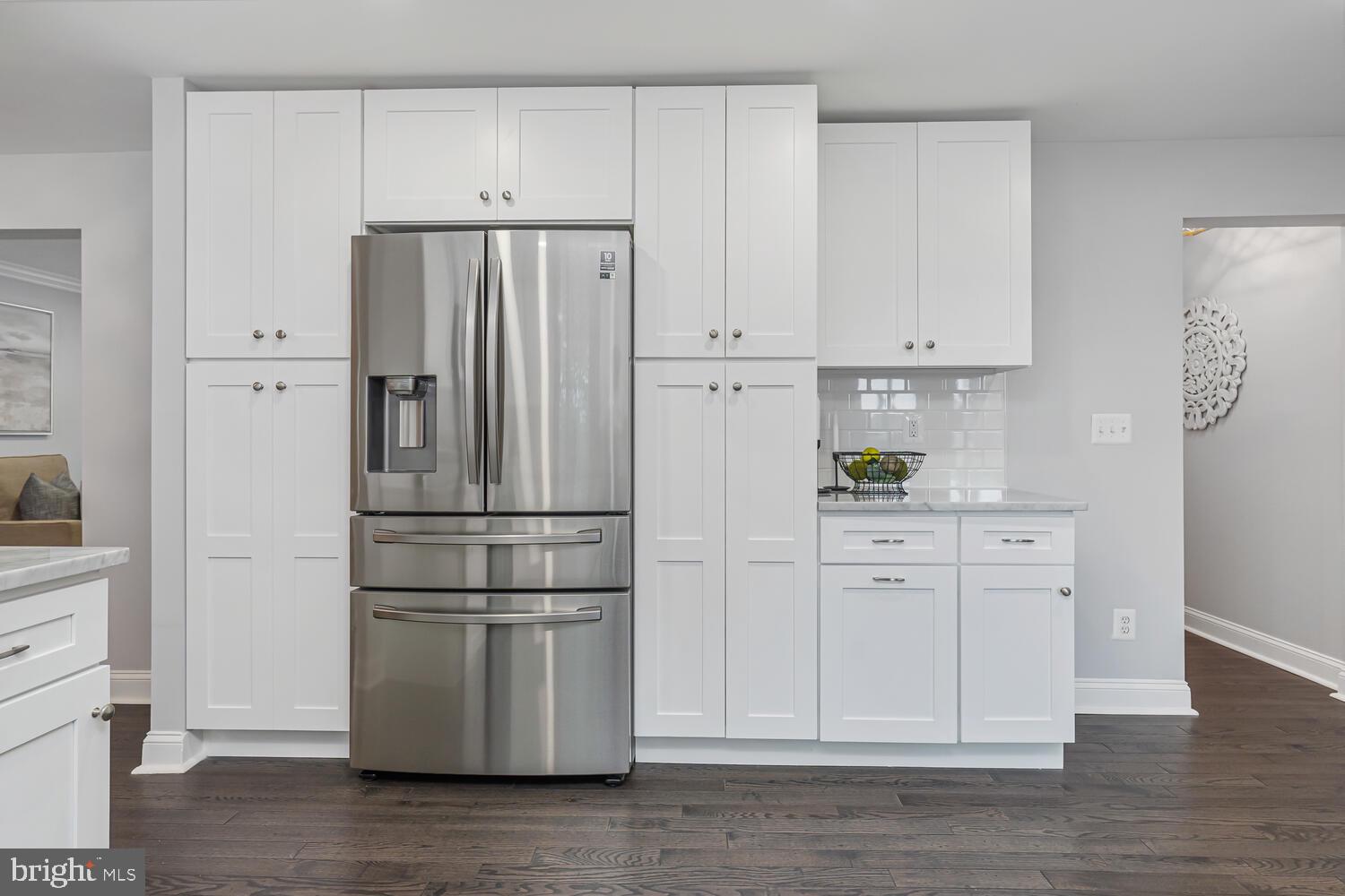 9020 Moonstone Road Baltimore, MD 21236 - Photo 15 of 30 a kitchen with white cabinets and stainless steel appliances