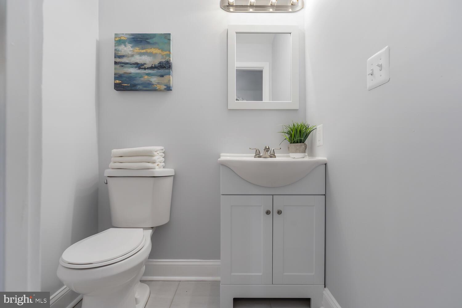 9020 Moonstone Road Baltimore, MD 21236 - Photo 16 of 30 a bathroom with a sink mirror and toilet