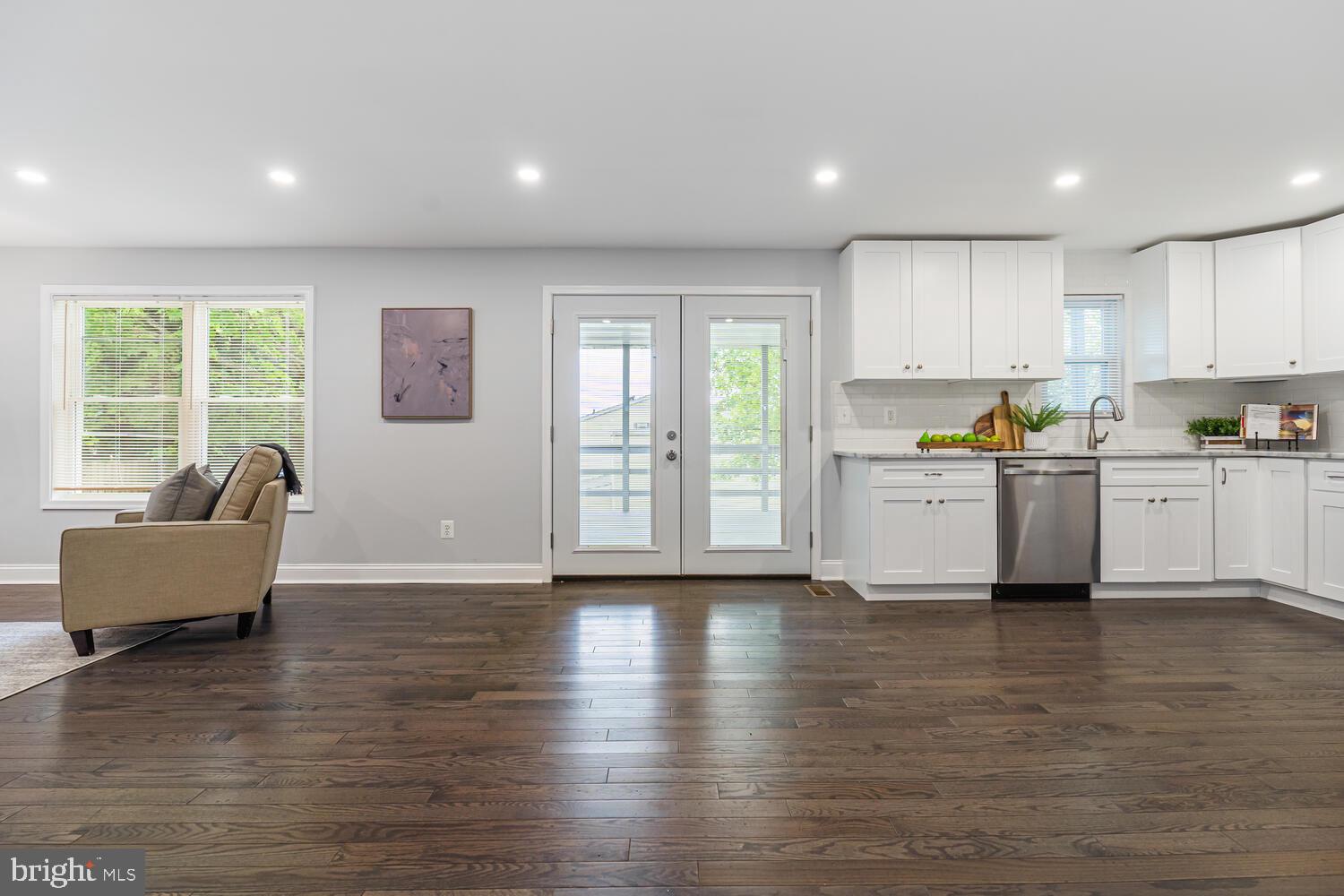 9020 Moonstone Road Baltimore, MD 21236 - Photo 20 of 30 a living room with stainless steel appliances furniture and a large window