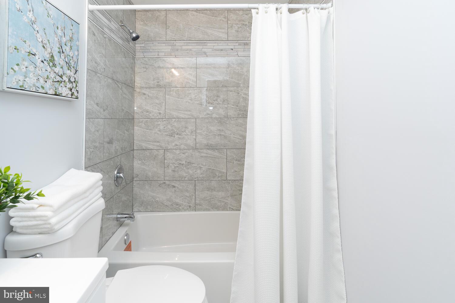 9020 Moonstone Road Baltimore, MD 21236 - Photo 22 of 30 a bathroom with a bathtub and shower