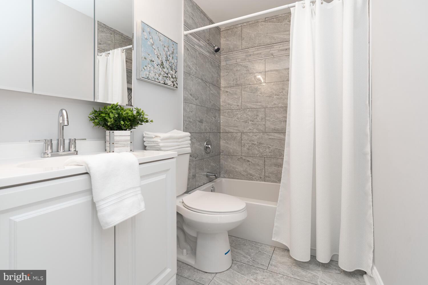 9020 Moonstone Road Baltimore, MD 21236 - Photo 23 of 30 a bathroom with a sink toilet and shower
