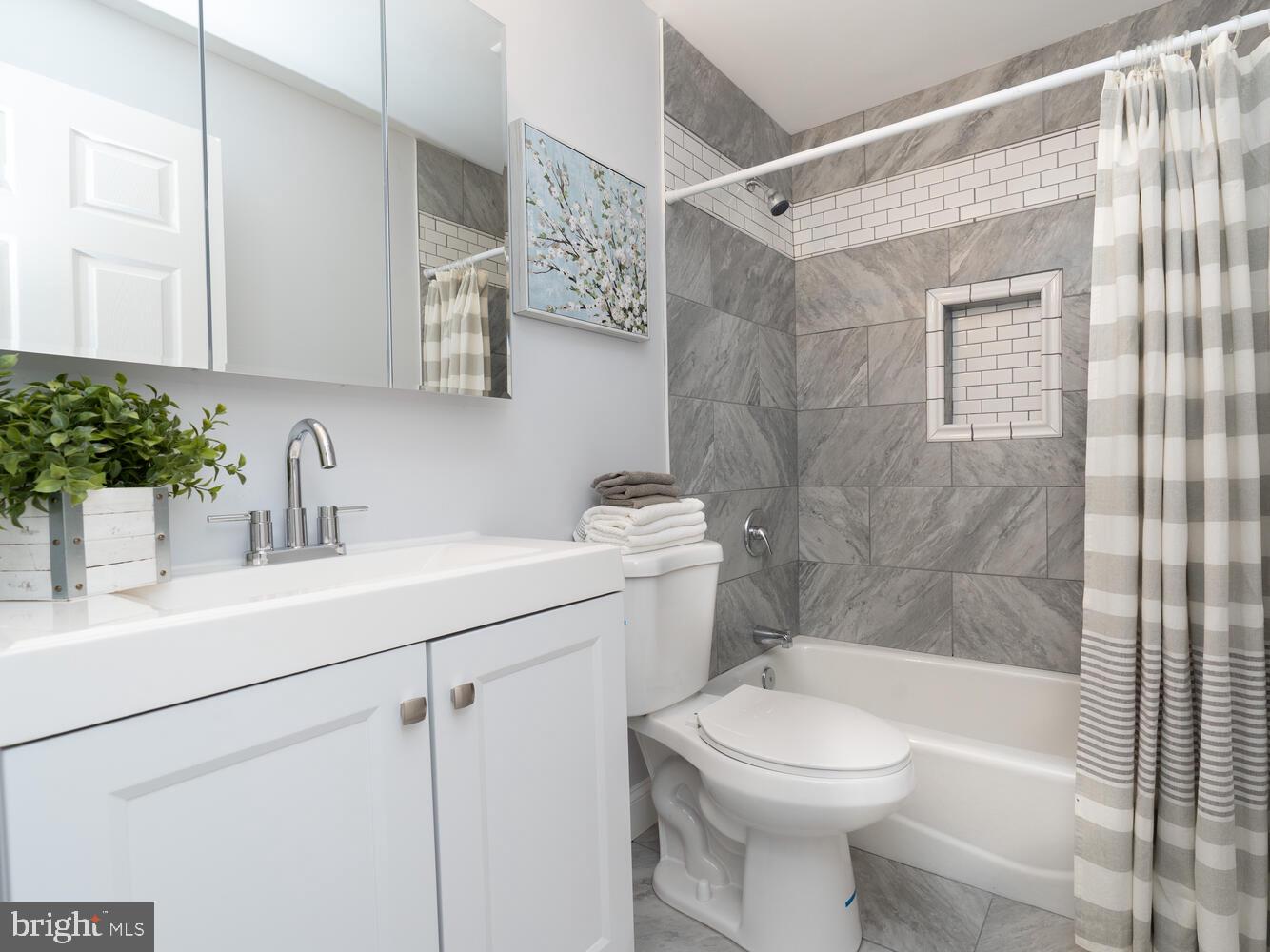 9020 Moonstone Road Baltimore, MD 21236 - Photo 24 of 30 a bathroom with a sink toilet and shower