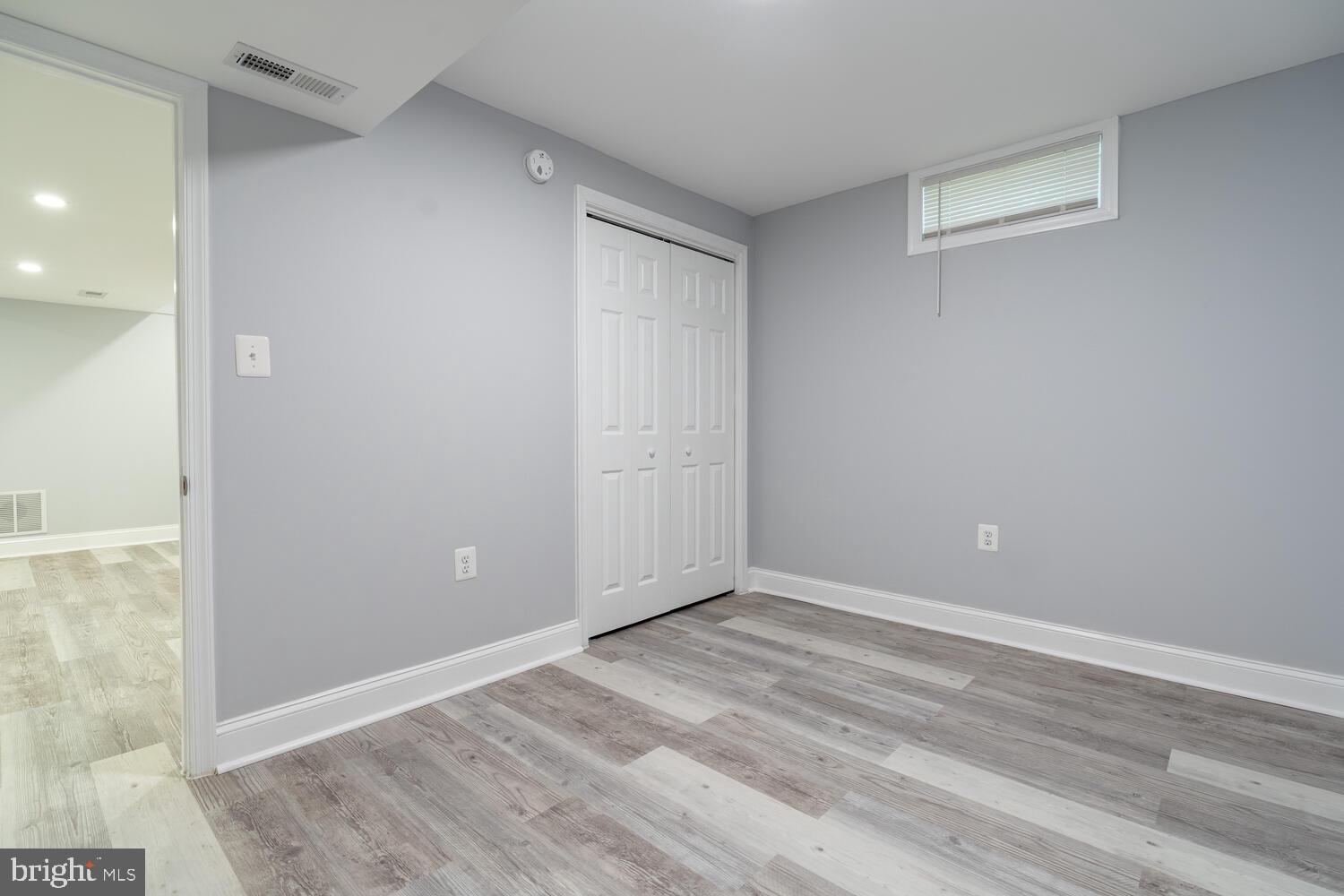 9020 Moonstone Road Baltimore, MD 21236 - Photo 27 of 30 wooden floor in an empty room
