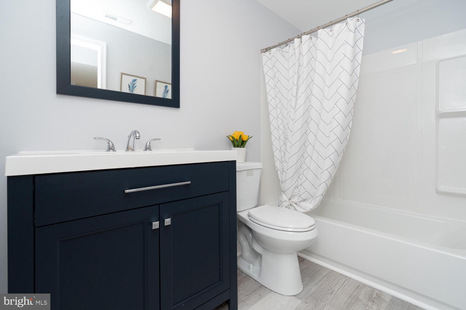 9020 Moonstone Road Baltimore, MD 21236 - Photo 28 of 30 a bathroom with a sink a toilet and a bathtub