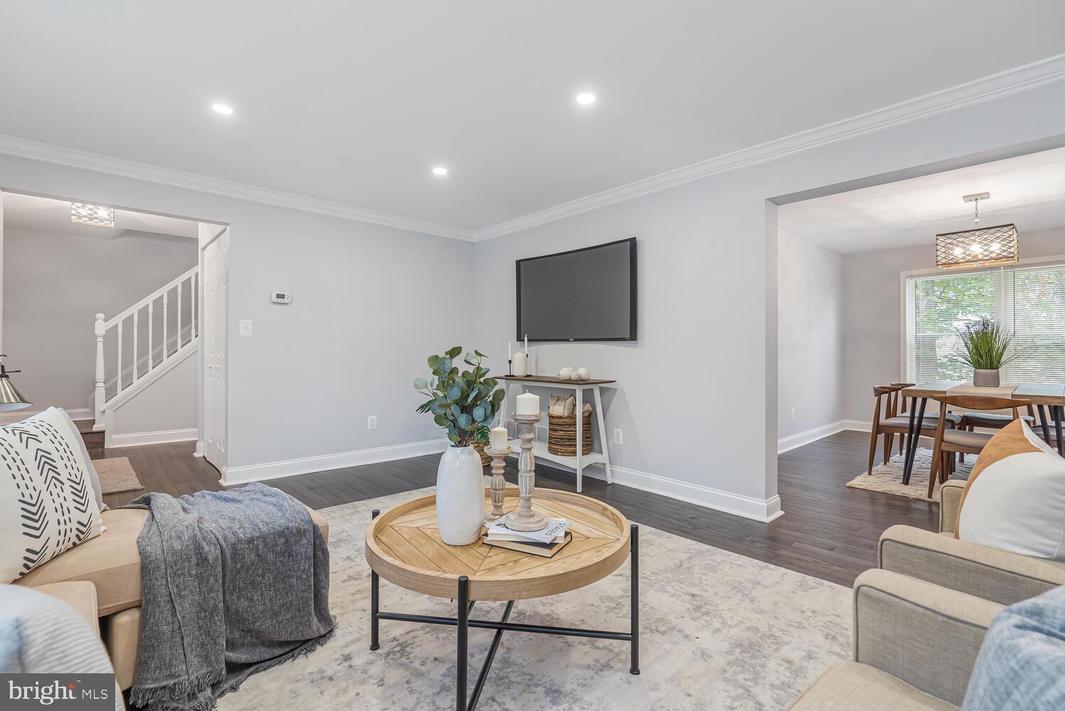 9020 Moonstone Road Baltimore, MD 21236 - Photo 8 of 30 a living room with furniture and a wooden floor