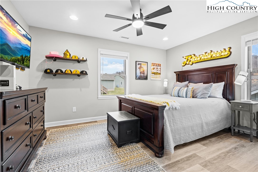 513 Townhomes Place, Unit 27 Boone, NC 28607 - Photo 16 of 33 a bedroom with a bed and a flat screen tv