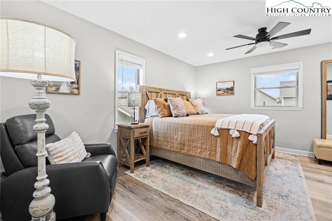 513 Townhomes Place, Unit 27 Boone, NC 28607 - Photo 20 of 33 a bedroom with a bed and wooden floor