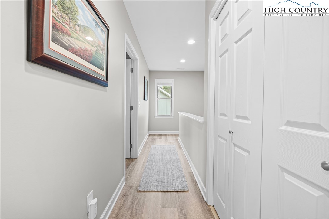 513 Townhomes Place, Unit 27 Boone, NC 28607 - Photo 25 of 33 a view of a hallway with wooden floor and entryway
