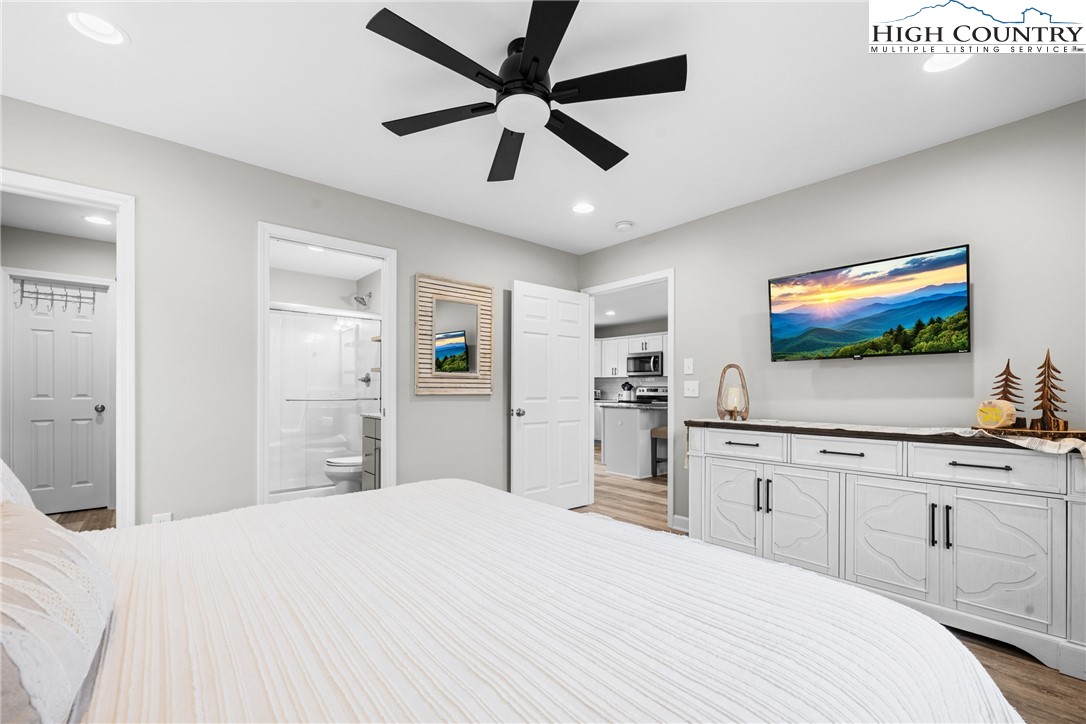 513 Townhomes Place, Unit 27 Boone, NC 28607 - Photo 7 of 33 a bedroom with a bed and a flat screen tv