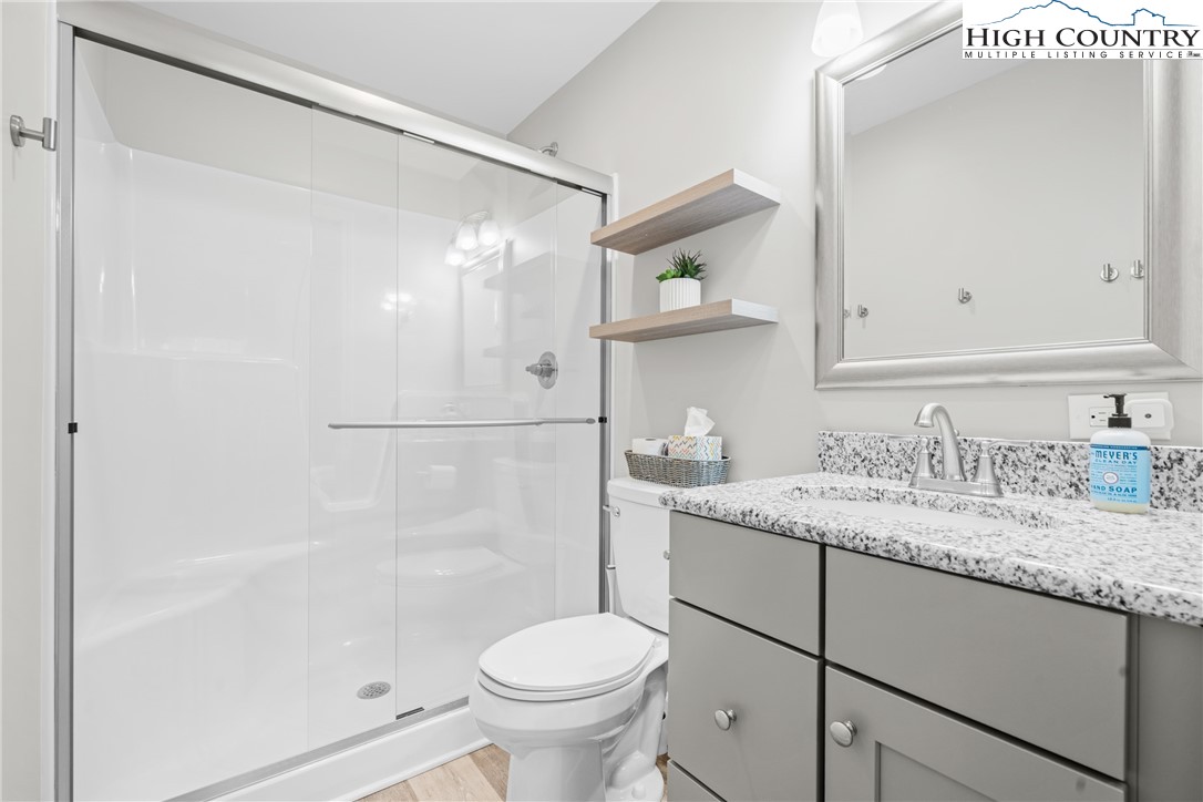 513 Townhomes Place, Unit 27 Boone, NC 28607 - Photo 8 of 33 a bathroom with a sink and a mirror