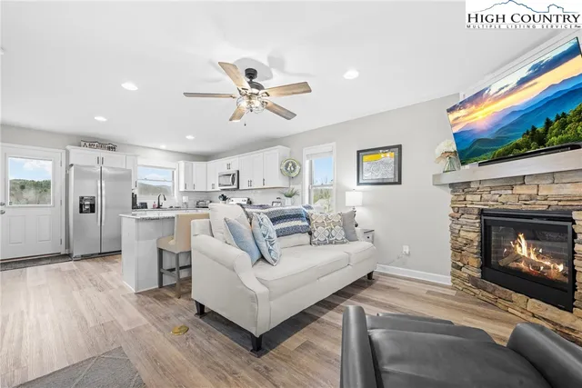 a living room with furniture and a fireplace