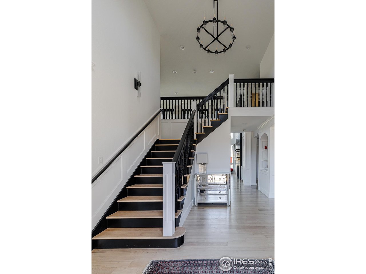 7401 Deerfield Road Longmont, CO 80503 - Photo 26 of 49 Entry staircase leading to 3 bedrooms, 2 bonus rooms