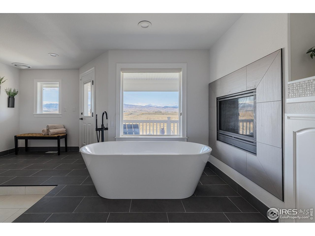 7401 Deerfield Road Longmont, CO 80503 - Photo 30 of 49 Long's Peak framed in the Primary en-suite