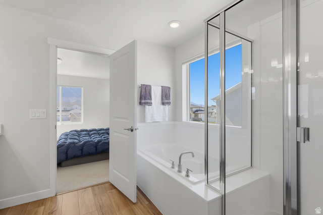 1353 Mapleton Hts Court Mapleton, UT 84664 - Photo 21 of 50 Primary Suite Bathroom featuring connected bathroom, light wood-type flooring, a shower stall, a bath, and recessed lighting
