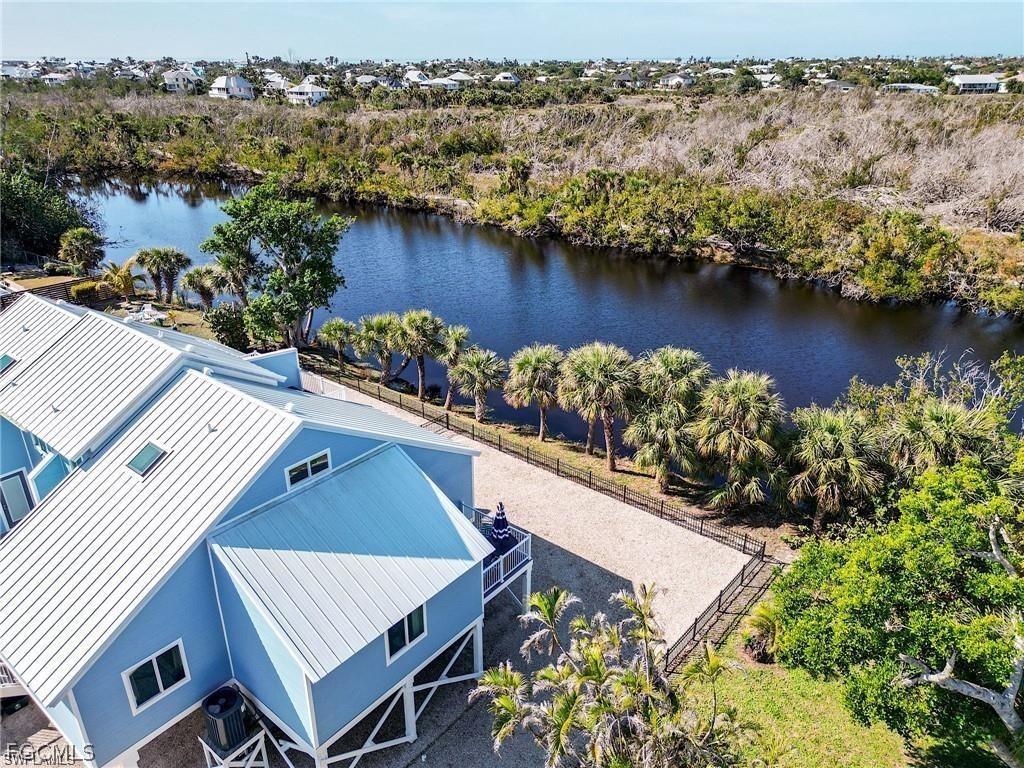 785 Rabbit Road Sanibel, FL 33957 - Photo 7 of 32 an aerial view of a house with a lake view