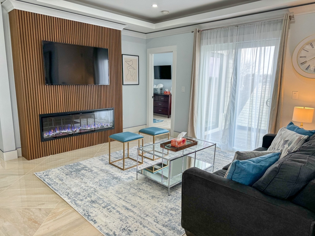 31 Train Street, Unit 3FURNISHED Boston, MA 02122 - Photo 2 of 17 a living room with furniture and a fireplace