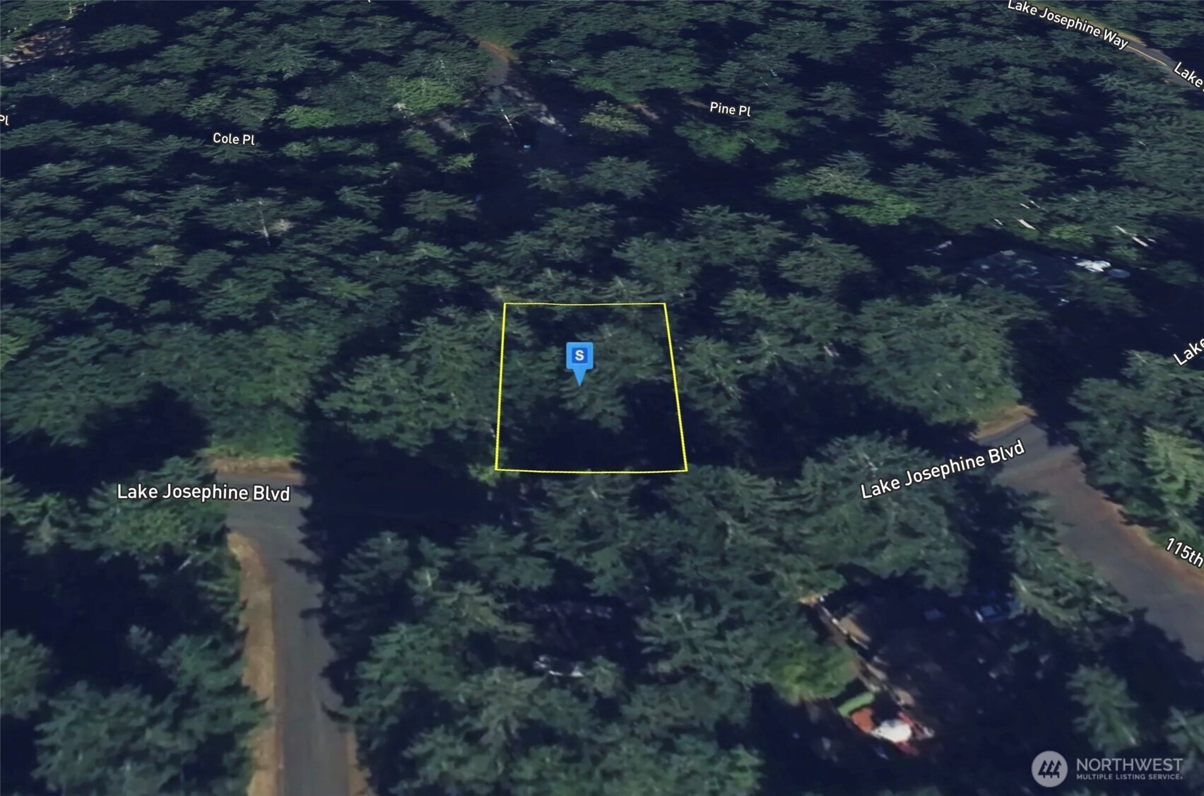 11507 Lake Josephine Avenue Anderson Island, WA 98303 - Photo 3 of 5 a sign that is sitting in a backyard