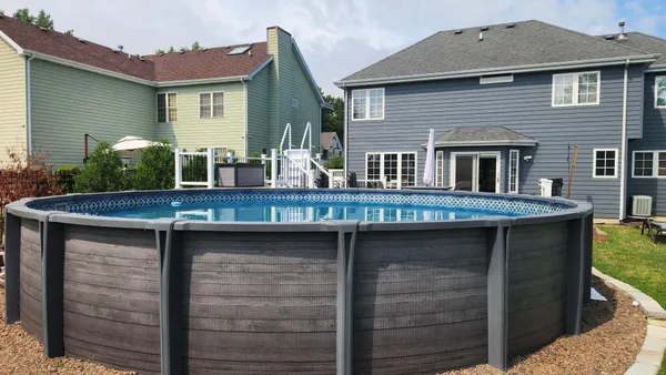 an aerial view of a house with swimming pool