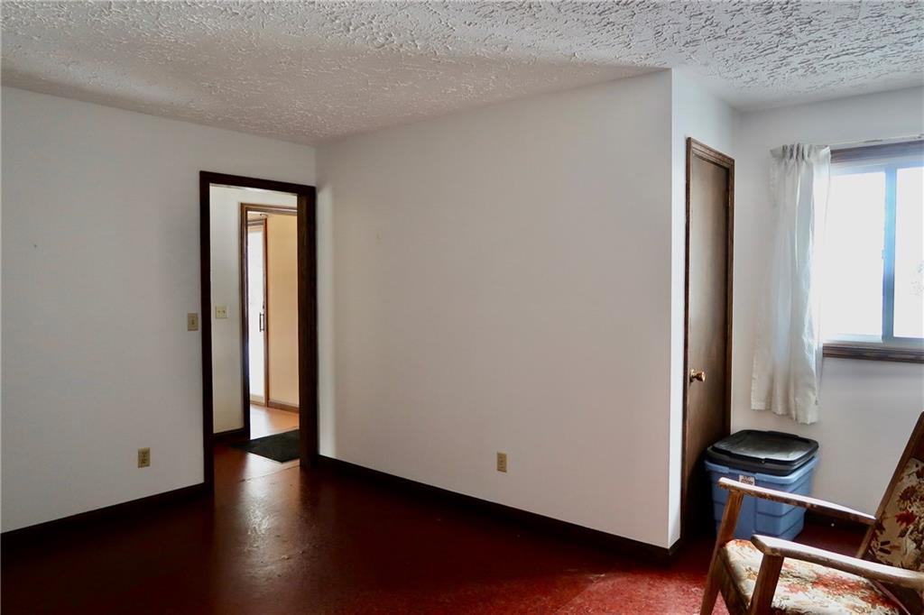 45 Plummer McCullough Road Mercer, PA 16137 - Photo 16 of 50 an empty room with wooden floor and windows