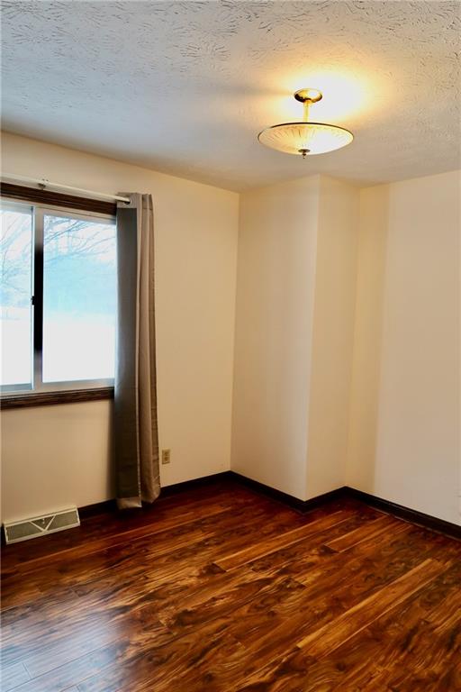 45 Plummer McCullough Road Mercer, PA 16137 - Photo 18 of 50 a view of empty room with wooden floor and fan