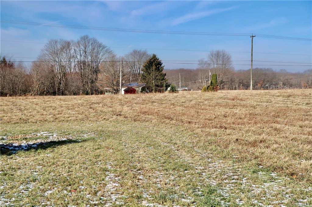 45 Plummer McCullough Road Mercer, PA 16137 - Photo 35 of 50 a large body of water with a building in the background