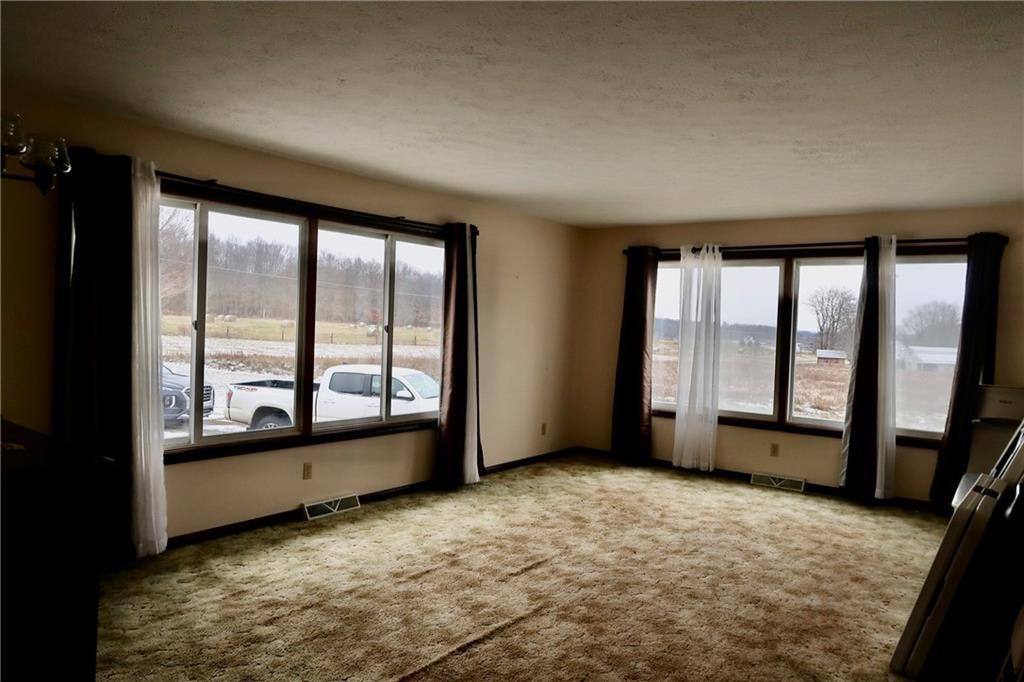 45 Plummer McCullough Road Mercer, PA 16137 - Photo 4 of 50 an empty room with large windows
