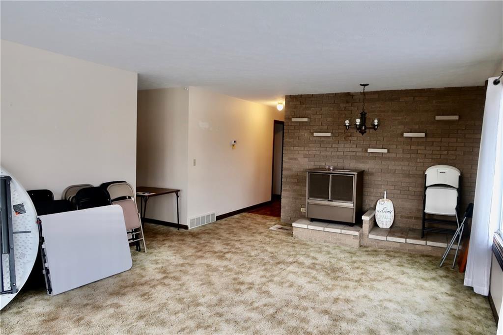 45 Plummer McCullough Road Mercer, PA 16137 - Photo 6 of 50 a view of livingroom with furniture and a fireplace