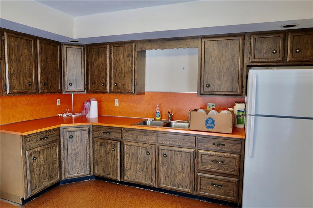 45 Plummer McCullough Road Mercer, PA 16137 - Photo 8 of 50 a kitchen with stainless steel appliances granite countertop a refrigerator and a sink