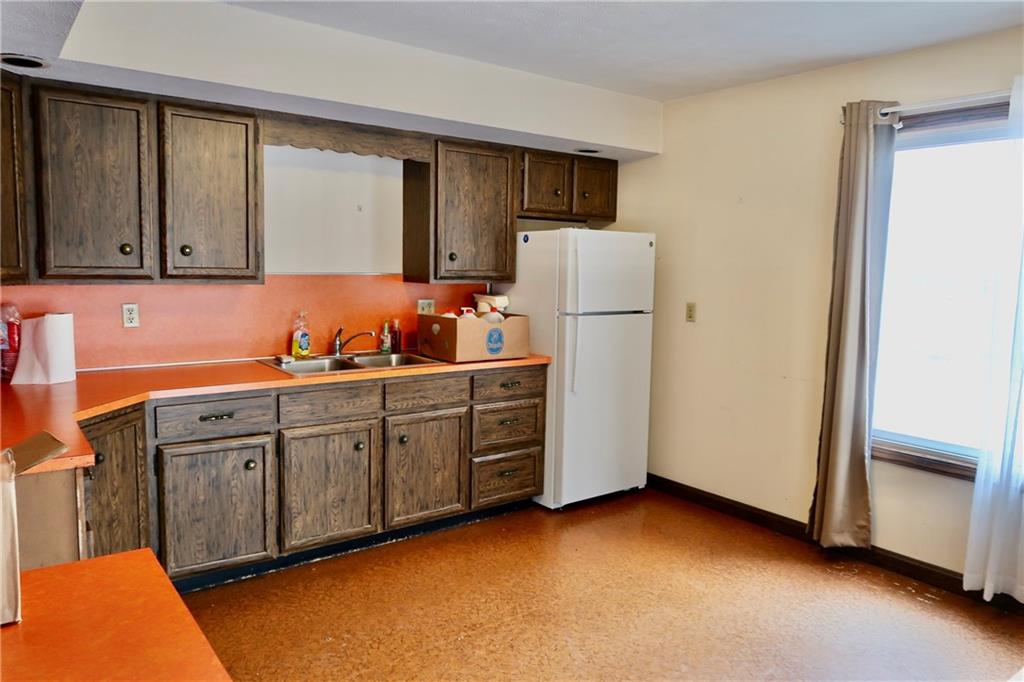 45 Plummer McCullough Road Mercer, PA 16137 - Photo 9 of 50 a kitchen with cabinets a refrigerator and a sink