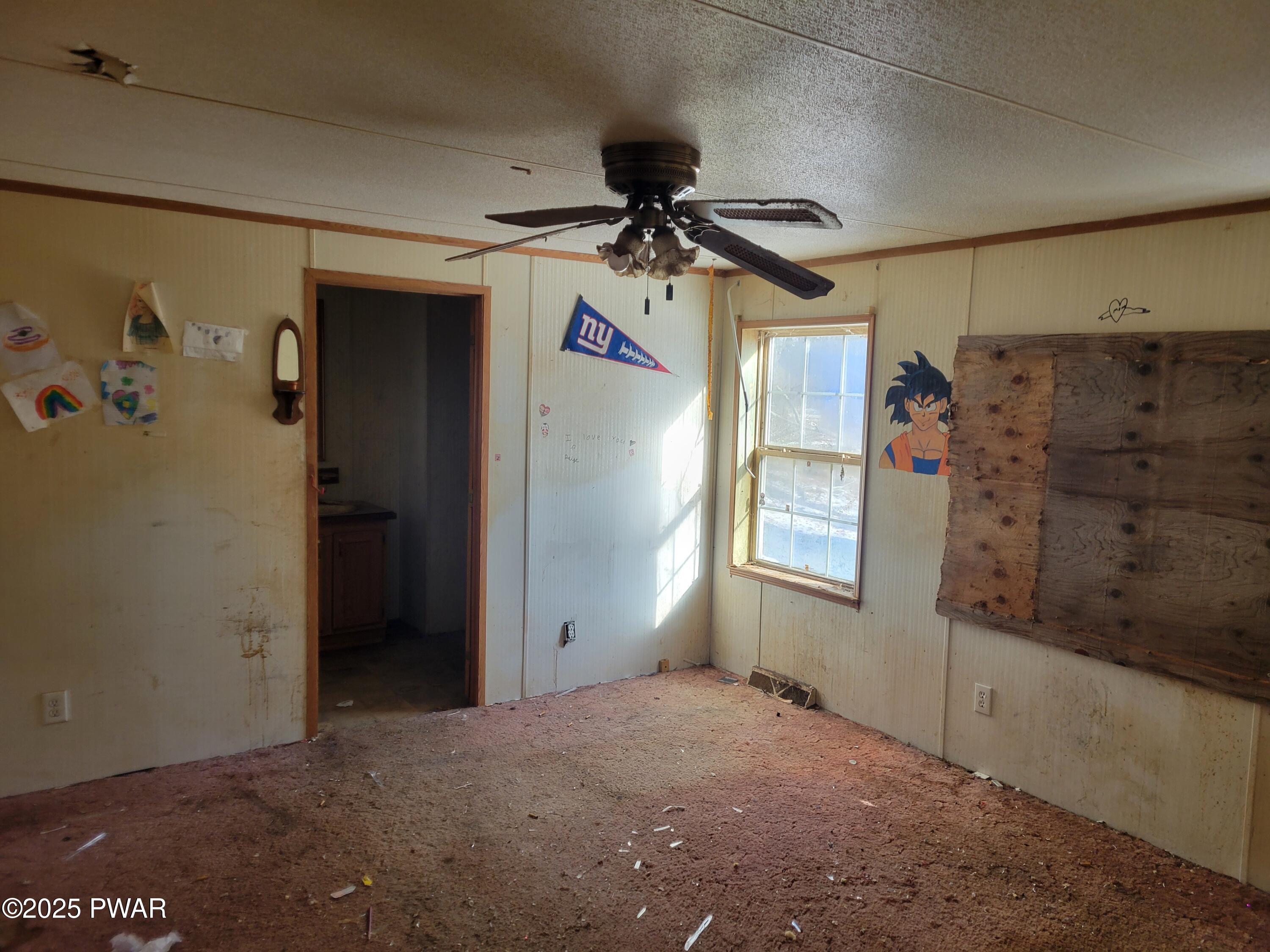 42 W Road Hawley, PA 18428 - Photo 6 of 11 a view of a hallway with a chandelier