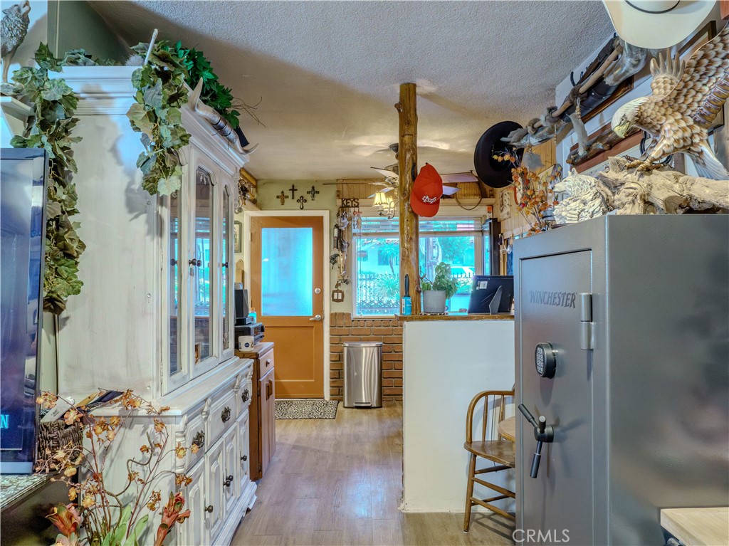 9413 Garfield Street Riverside, CA 92503 - Photo 20 of 33 an entryway with wooden floor and windows